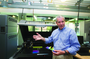 Figure 5.  RIT’s Denis Cormier discusses research at the AM Print Center.  